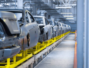 Modern automobile production line, automated production equipment. Shop for the Assembly of new modern cars. The way of Assembly of the car on the Assembly line at the plant